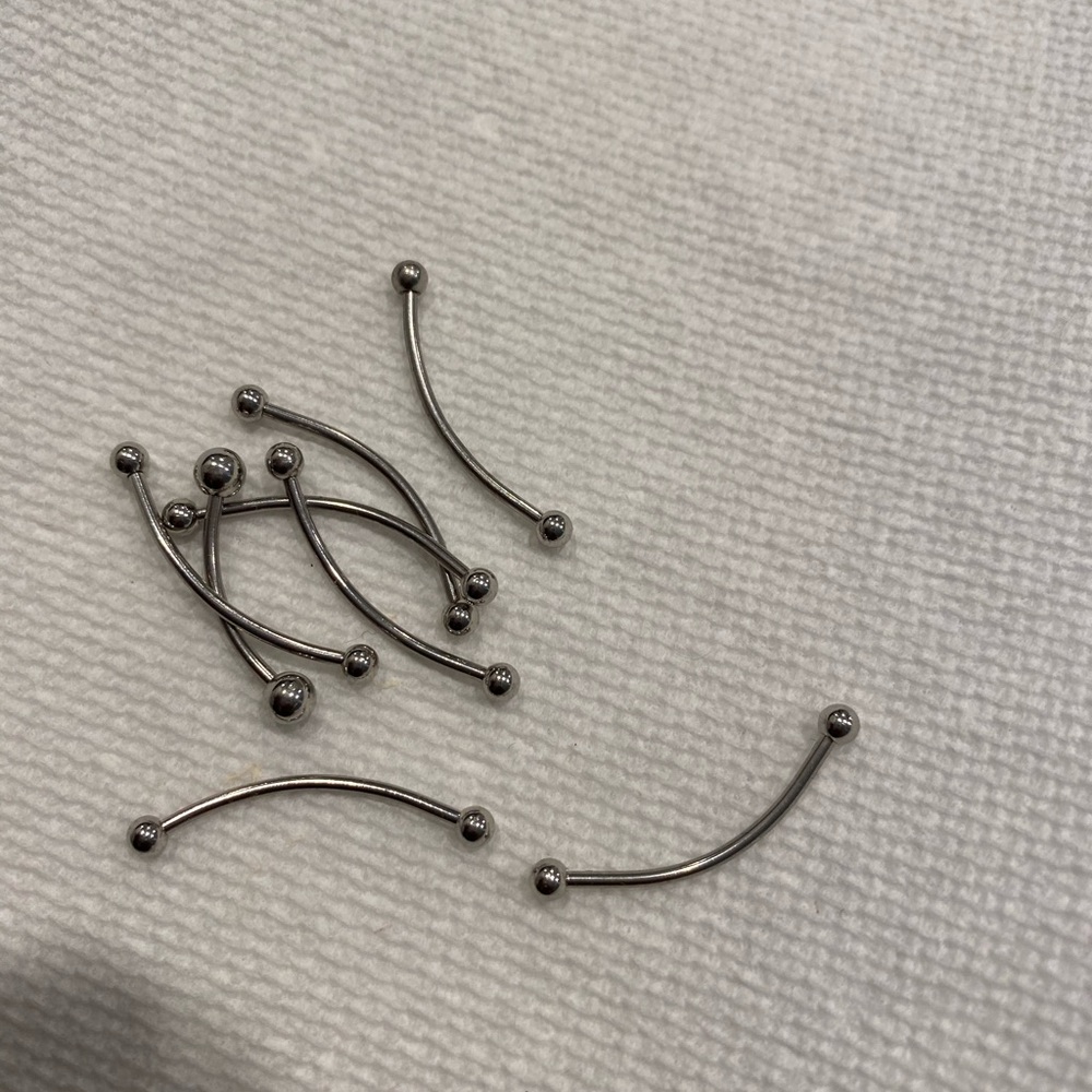 Snake eye curved barbell